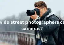 How do street photographers carry cameras?