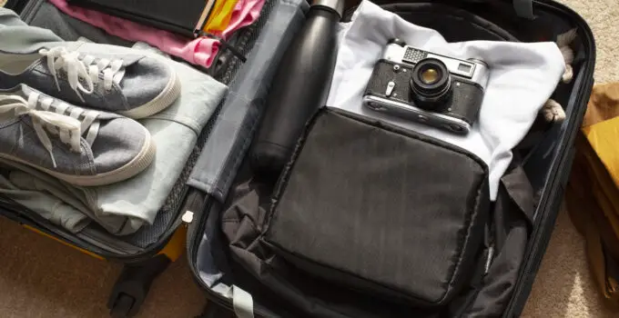 Are camera chargers allowed in checked bags?