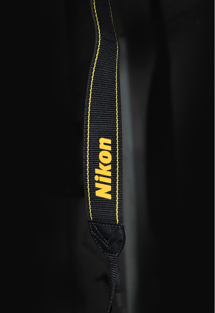 How to attach camera strap Nikon?