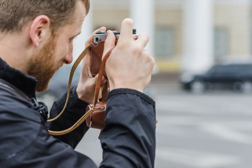 How to attach a lanyard to a camera?