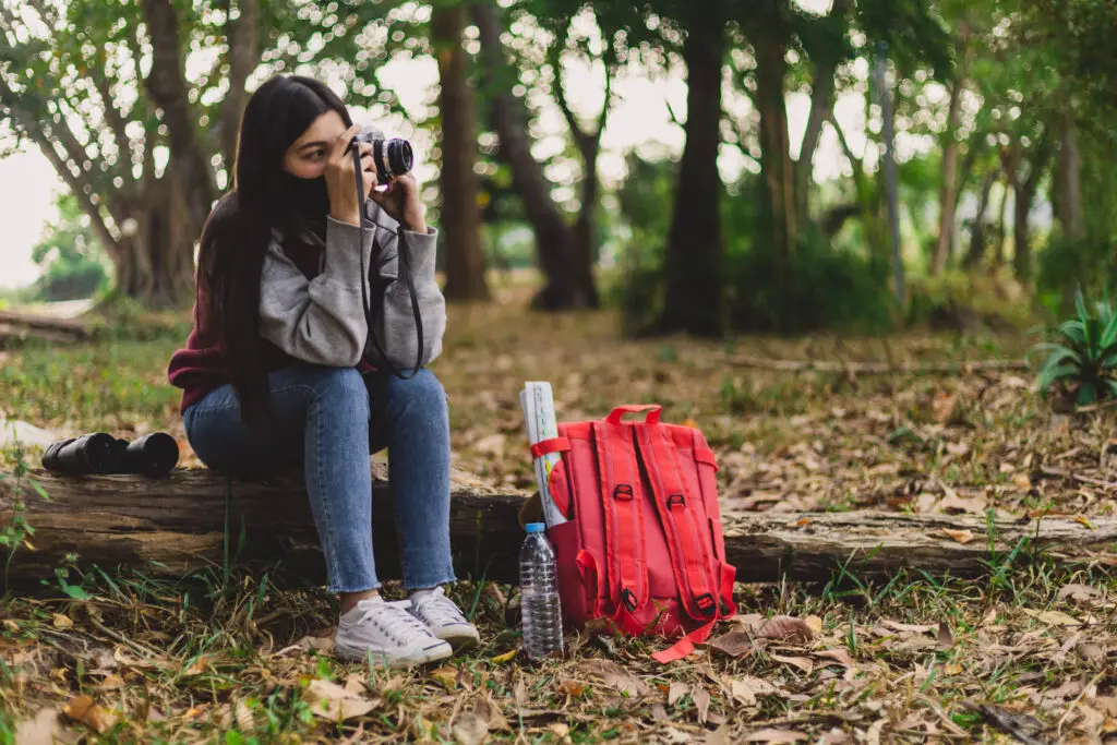 Should i put my canon camera in checked bags?